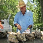 Andrew Zimmern of Bizarre Foods America shucks Louisiana oysters. Photo courtesy of the Travel Channel. Andrew Zimmern of Bizarre Foods America shucks Louisiana oysters. Photo courtesy of the Travel Channel.