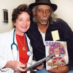 Catherine Lasperches and Big Chief Alfred Doucette at the New Orleans Musicians' Clinic. Photo by Caitlyn Ridenour. Catherine Lasperches and Big Chief Alfred Doucette at the New Orleans Musicians' Clinic. Photo by Caitlyn Ridenour.