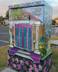 A decorated utility box at the intersection of Canal Street and Carrollton Avenue.
